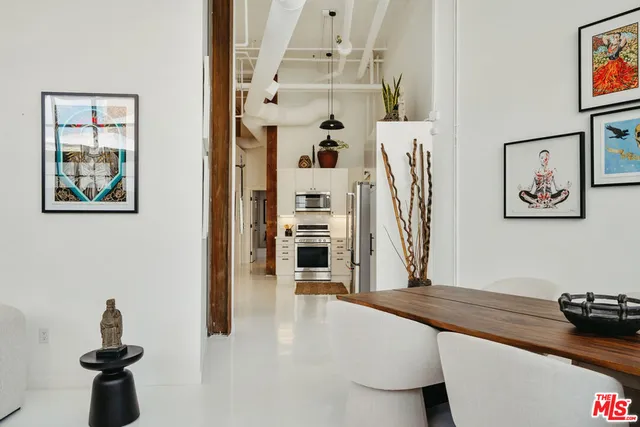a view of a living room and dining room