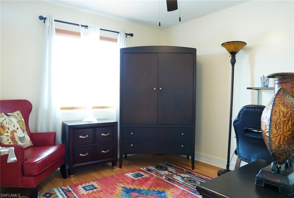 931 20th Street Southeast Naples, FL 34117 - Photo 12 of 21 a living room with furniture and a flat screen tv