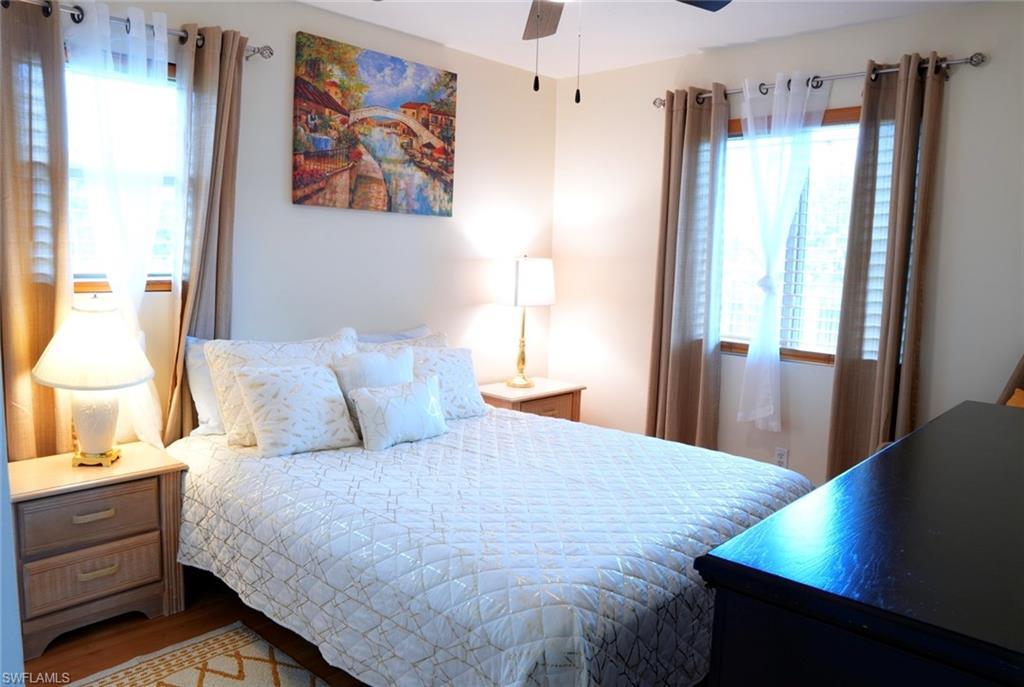 931 20th Street Southeast Naples, FL 34117 - Photo 14 of 21 a bedroom with a bed and a window