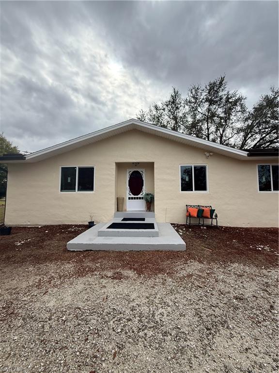 931 20th Street Southeast Naples, FL 34117 - Photo 3 of 21 a view of a house with backyard