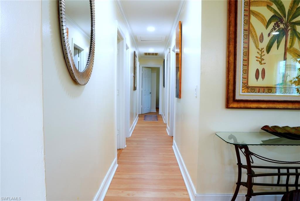 931 20th Street Southeast Naples, FL 34117 - Photo 9 of 21 a view of a hallway with furniture and a mirror