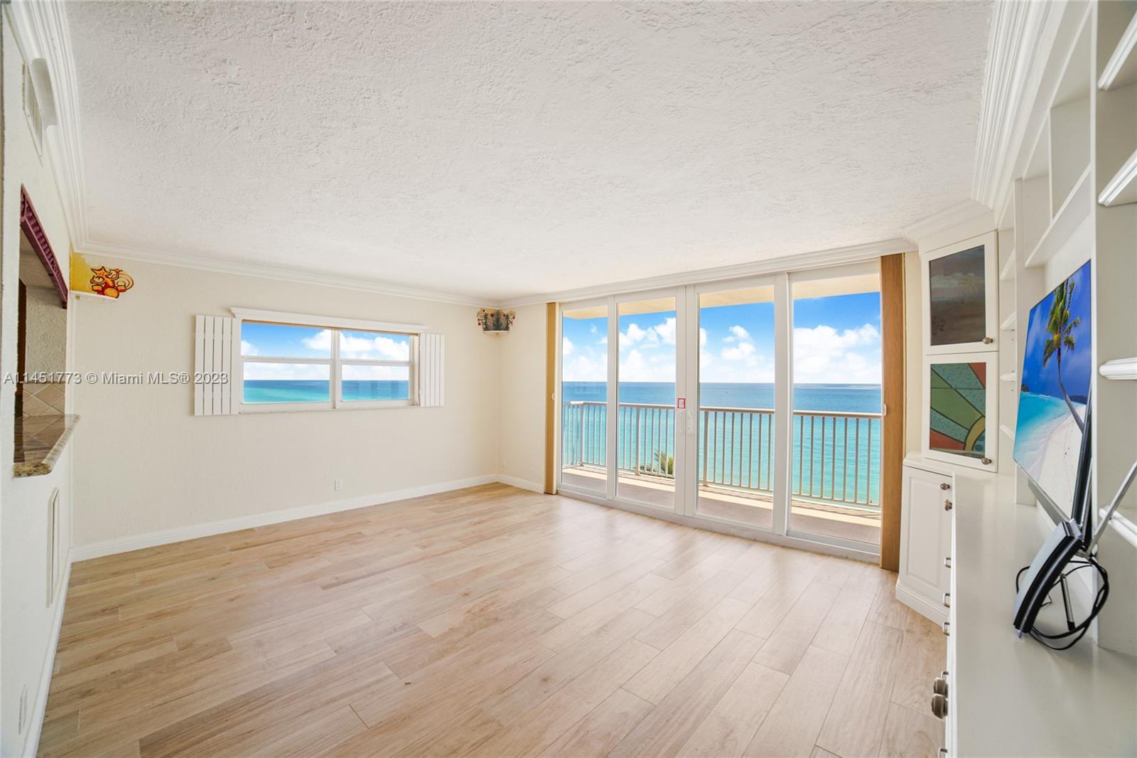 a view of a livingroom with wooden floor