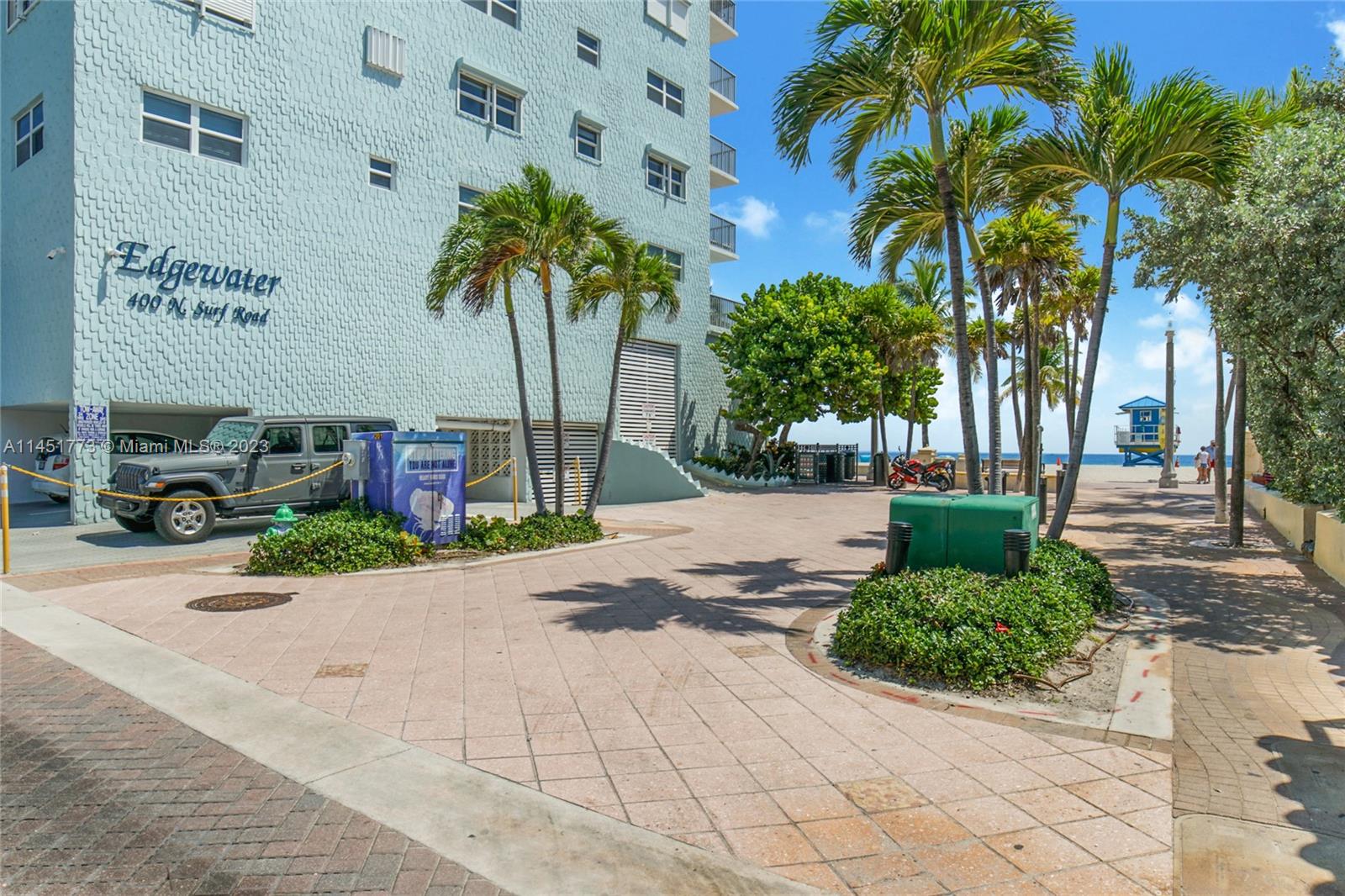 400 North Surf Road, Unit 801 Hollywood, FL 33019 - Photo 12 of 17 a front view of a building with palm trees