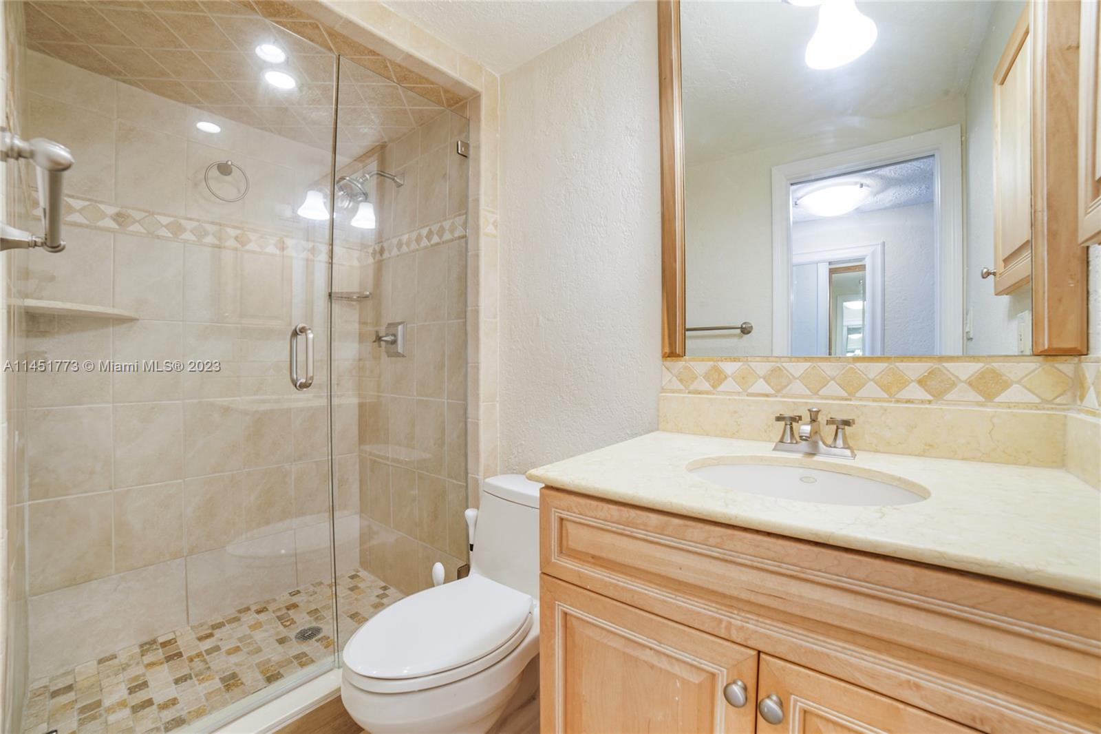 400 North Surf Road, Unit 801 Hollywood, FL 33019 - Photo 15 of 17 a bathroom with a sink a toilet and shower