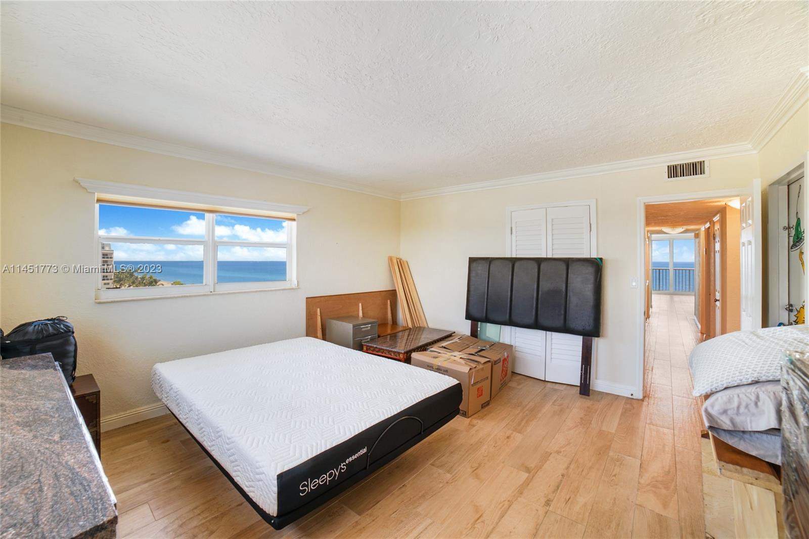 400 North Surf Road, Unit 801 Hollywood, FL 33019 - Photo 8 of 17 a bed room with a bed and window