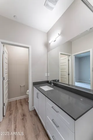 a front view of a house with a parking space