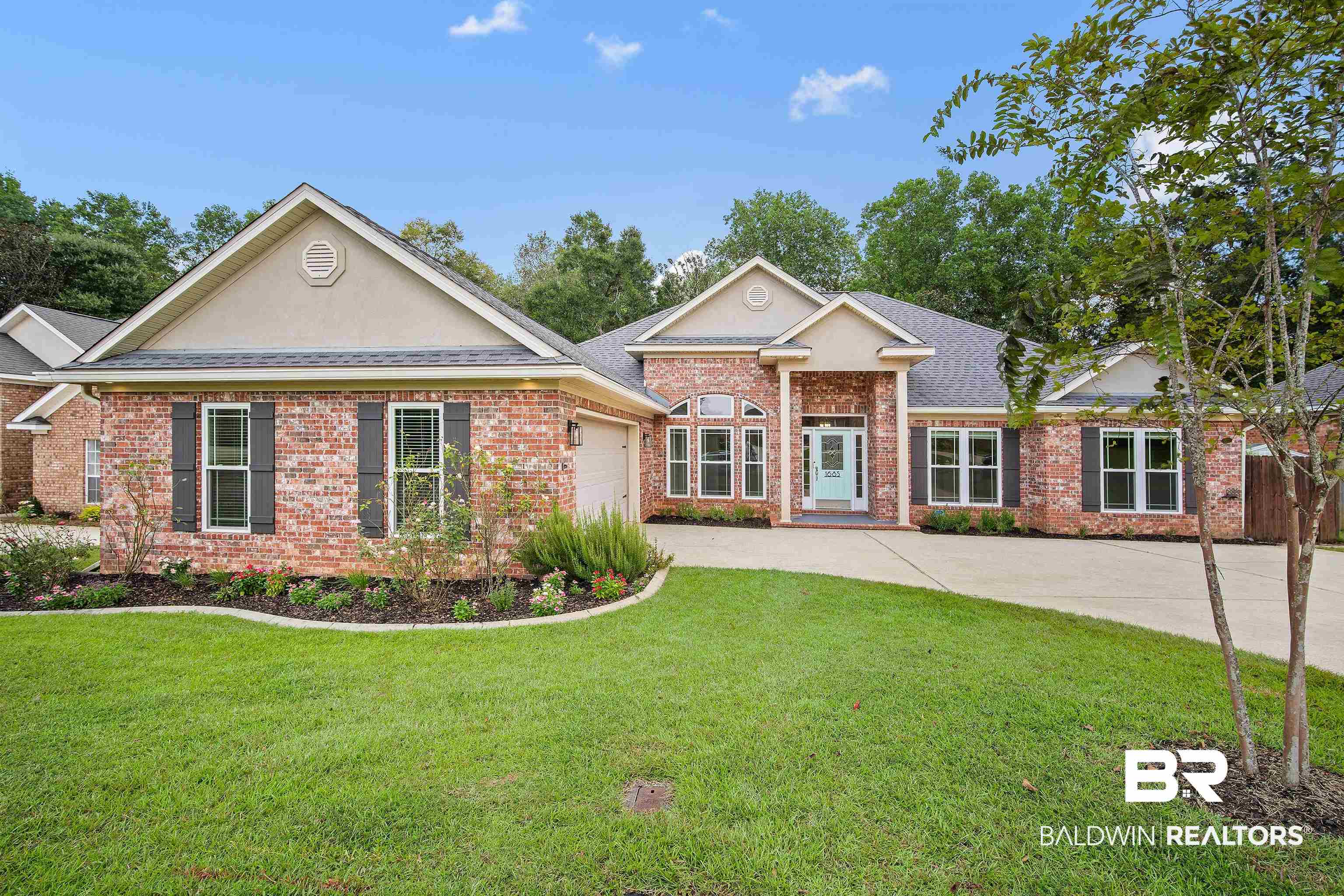 1685 Stonebridge Court Mobile, AL 36695 - Photo 1 of 29 Ranch-style house with a front lawn, brick siding, concrete driveway, and a garage