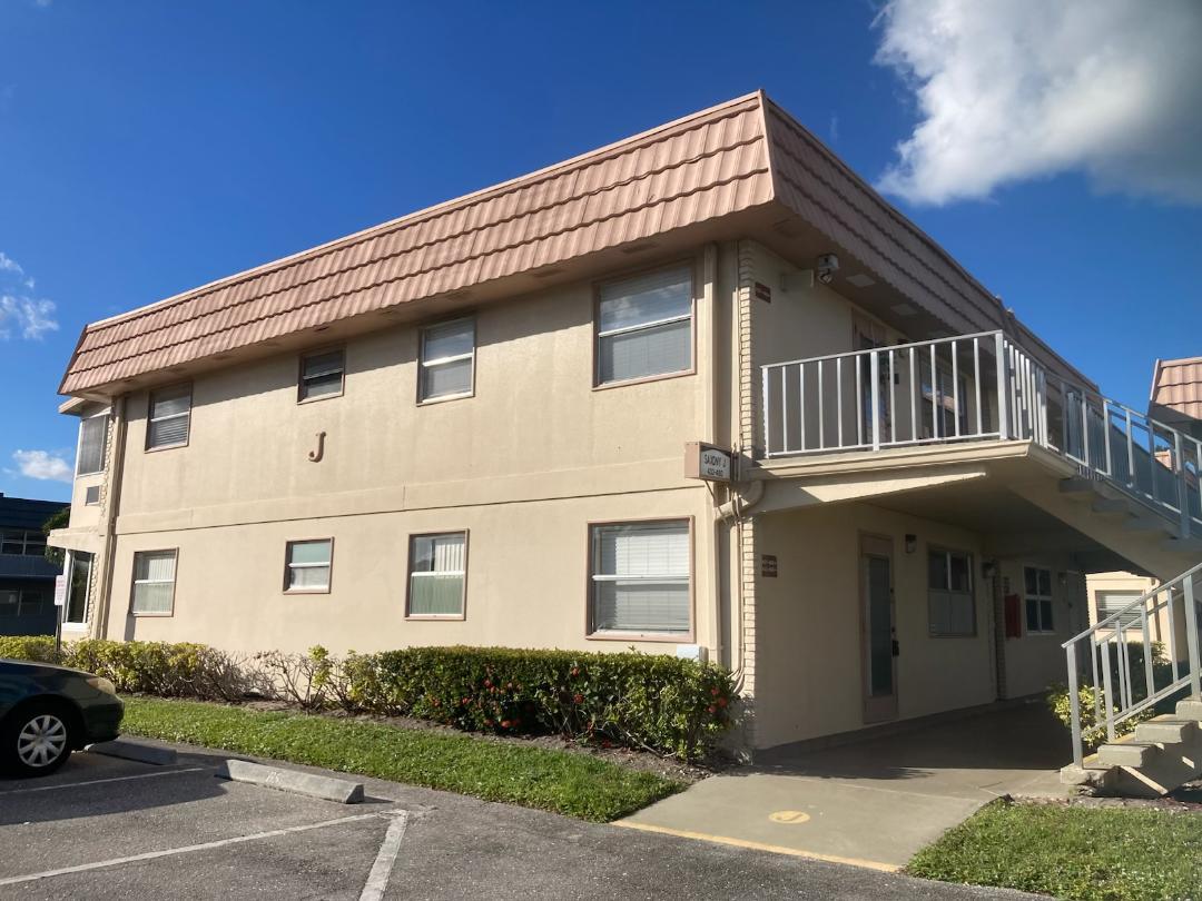 445 Saxony Way, Unit 445 Delray Beach, FL 33446 - Photo 1 of 10 a view of a house with a yard