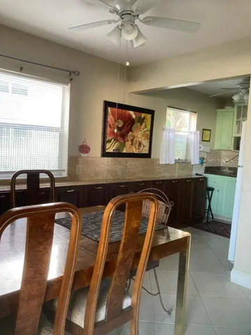 a view of a dining room with furniture and window
