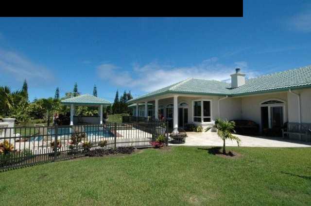220 North Holokai Road Haiku, HI 96708 - Photo 1 of 29 a view of a house with backyard porch and sitting area