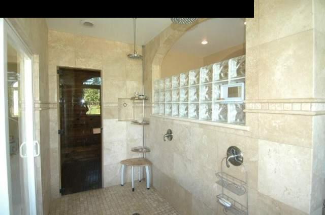 220 North Holokai Road Haiku, HI 96708 - Photo 16 of 29 a bathroom with a glass shower door