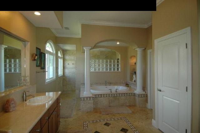 220 North Holokai Road Haiku, HI 96708 - Photo 7 of 29 a bathroom with a granite countertop sink a toilet and a shower