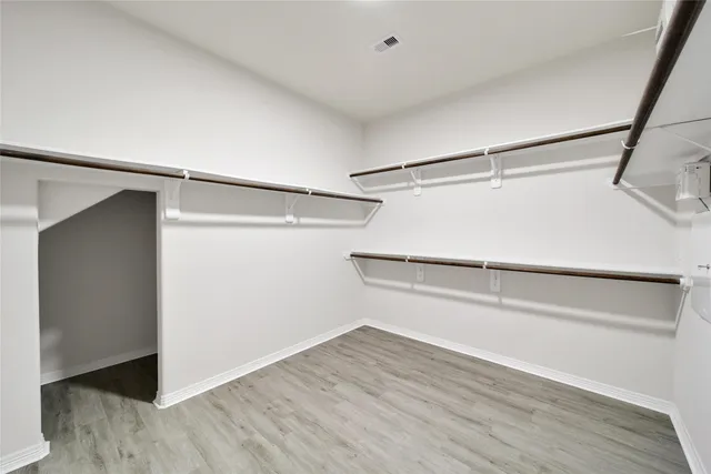a view of an empty walk in closet