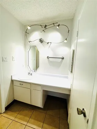 a bathroom with a double vanity sink and mirror