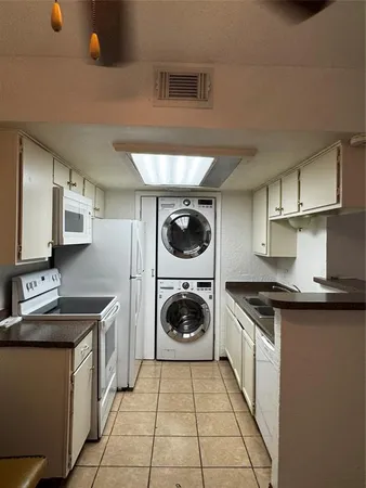 a kitchen with a stove and a sink