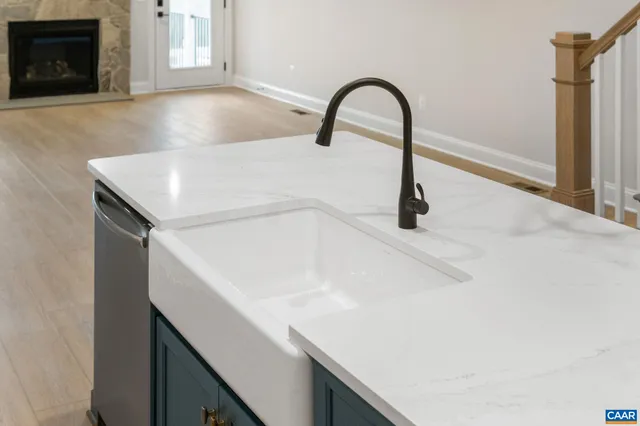 a stove top oven sitting inside of a kitchen