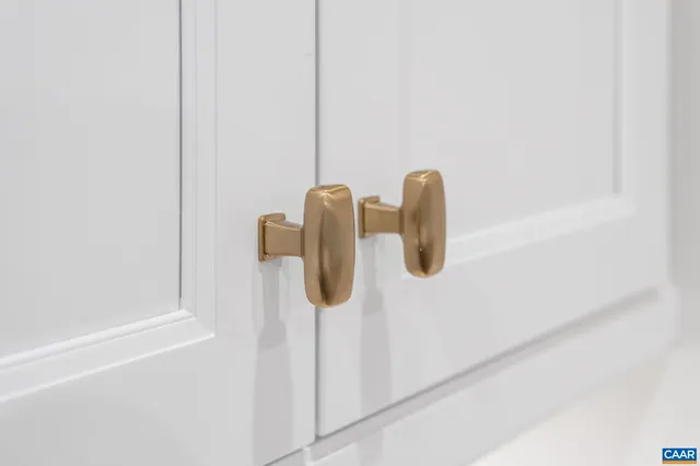 a kitchen with stainless steel appliances a sink a stove a refrigerator and island