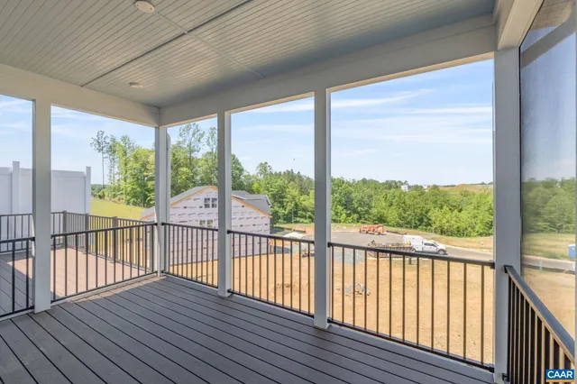 a view of a porch with wooden floor and outdoor space