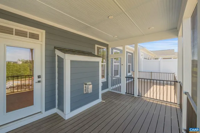 a view of a balcony with wooden floor