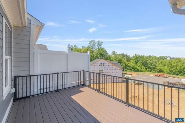 a view of a balcony with wooden floor