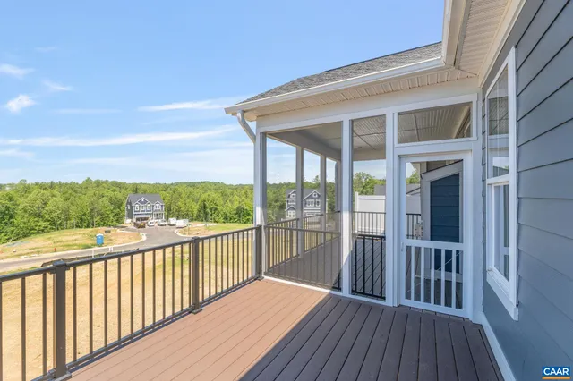 a view of a room with kitchen island and wooden floor