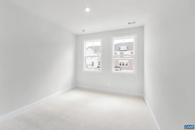 a bathroom with a double vanity sink mirror and shower
