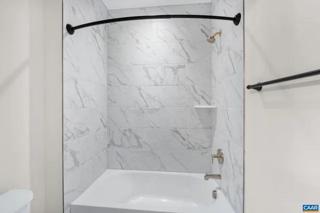 a view of a room with wooden walls