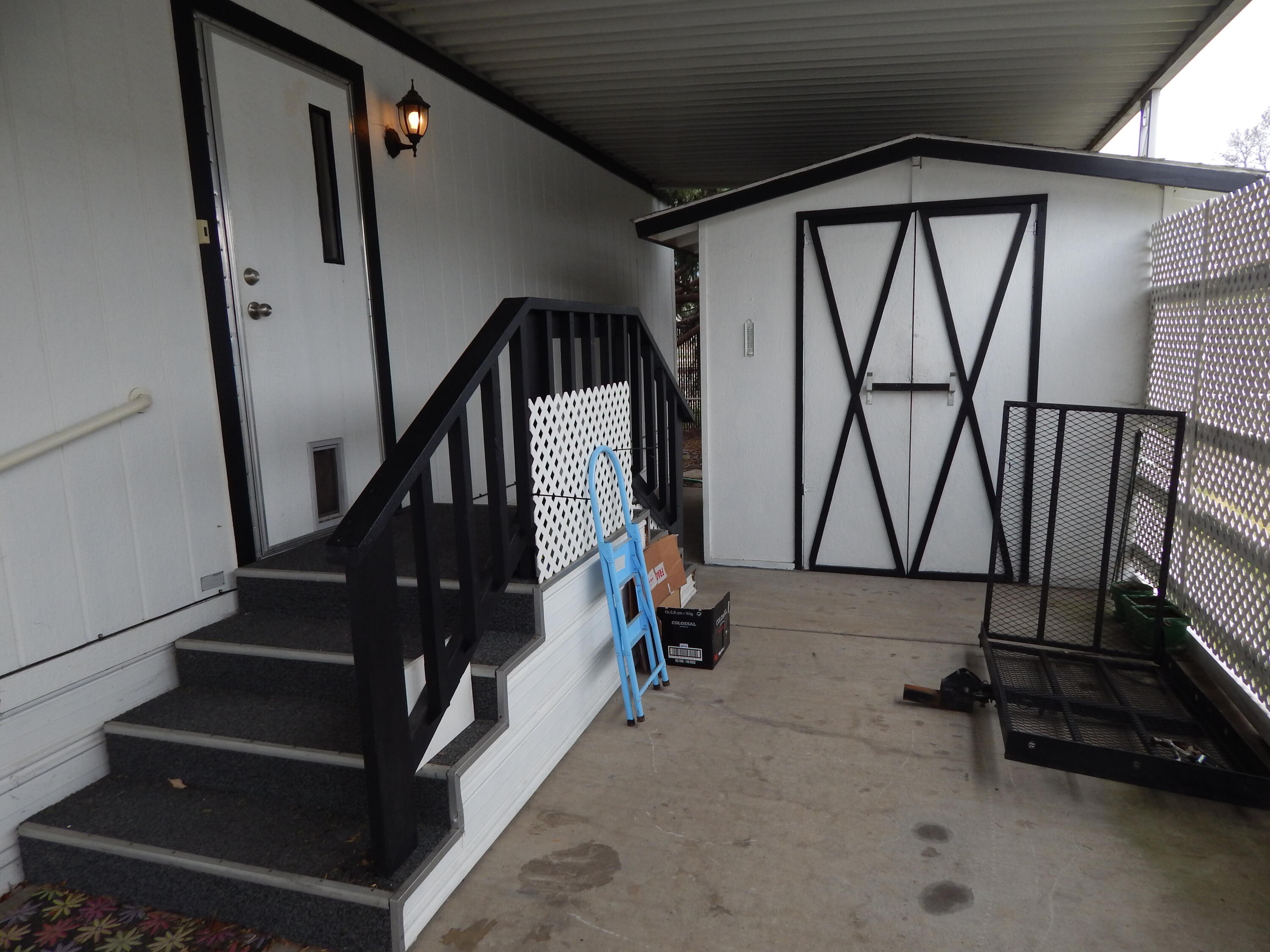 255 Colver Road, Unit 87 Talent, OR 97540 - Photo 17 of 20 Back door & shed
