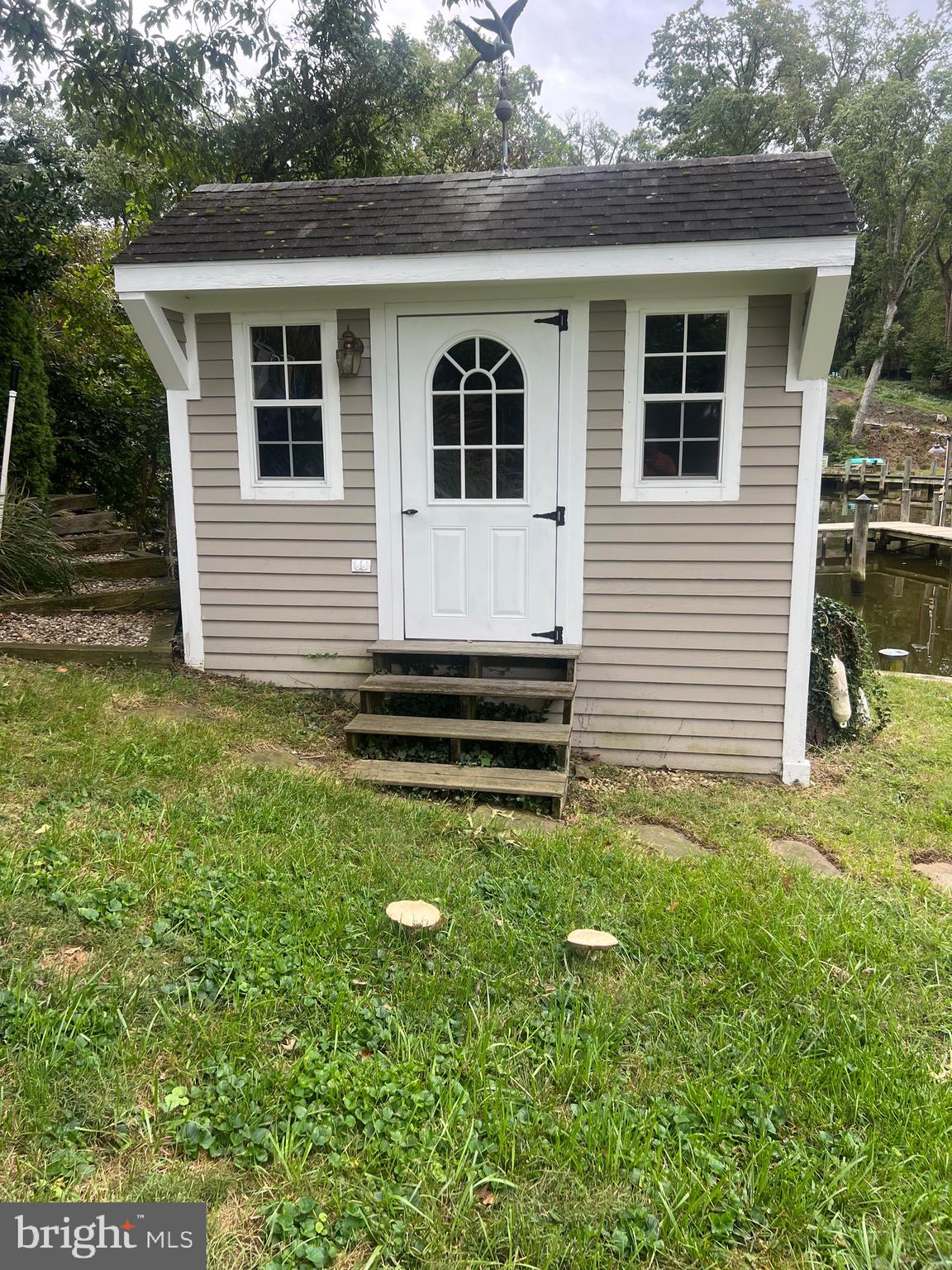 111 Virginia Avenue Edgewater, MD 21037 - Photo 12 of 80 a front view of a house with garden