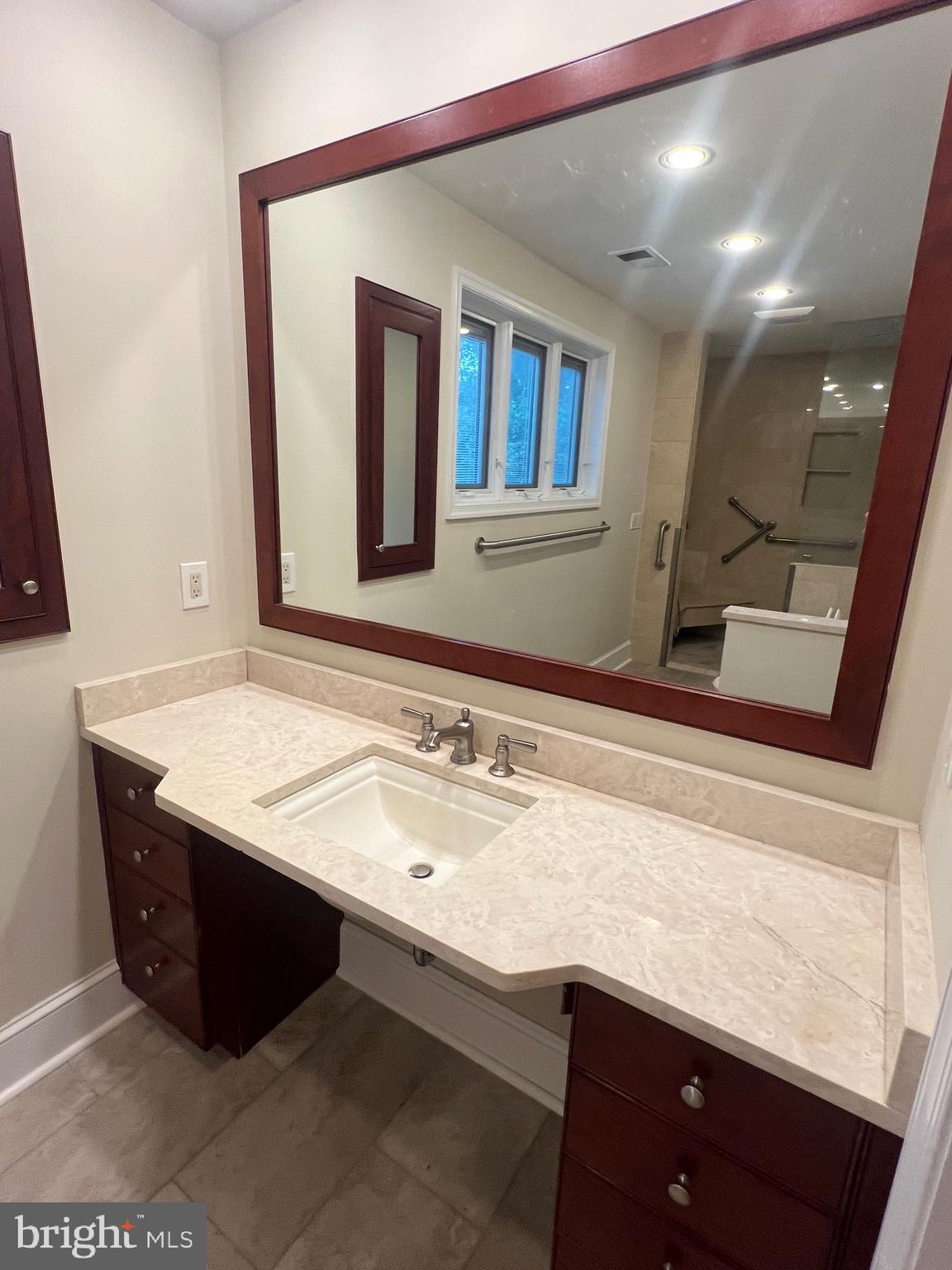 111 Virginia Avenue Edgewater, MD 21037 - Photo 22 of 80 a bathroom with a sink and a mirror