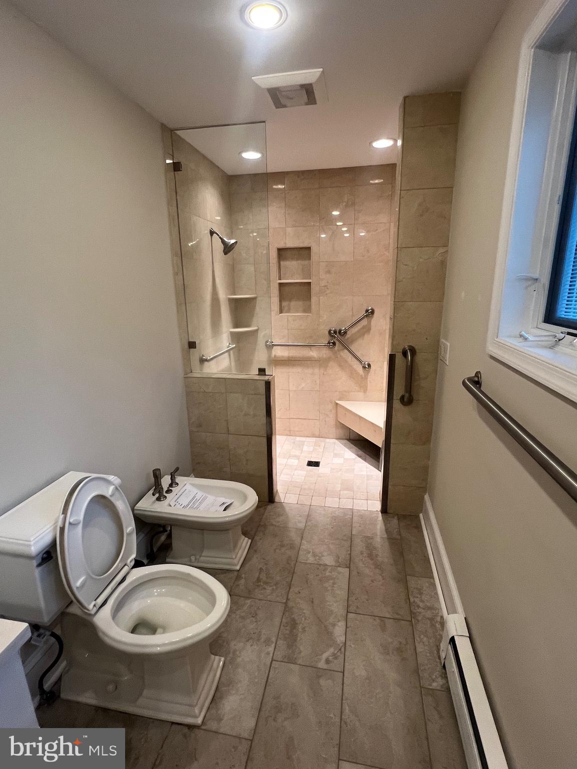 111 Virginia Avenue Edgewater, MD 21037 - Photo 23 of 80 a bathroom with a toilet a sink and mirror