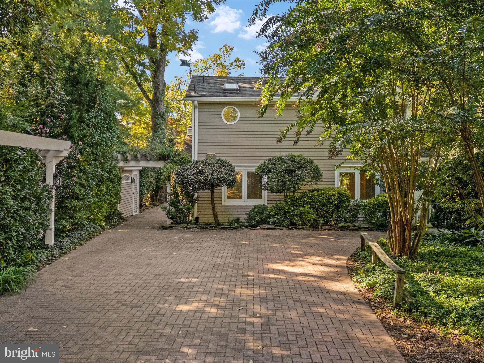 111 Virginia Avenue Edgewater, MD 21037 - Photo 25 of 80 a view of a street with potted plants and large trees