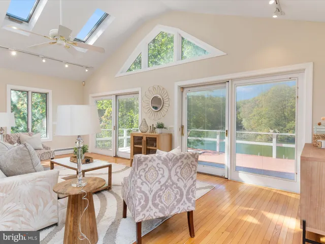 an aerial view of a house with outdoor space lake view and boat