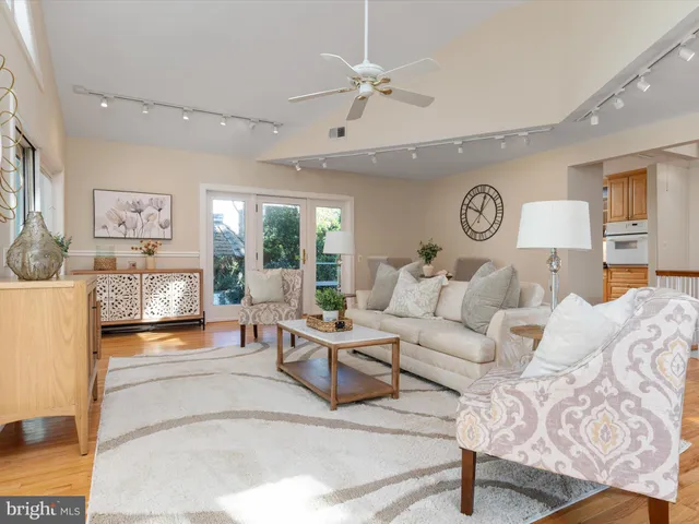 a bedroom with a large bed and a large window