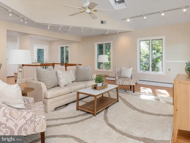 a bedroom with a bed and a wooden floor