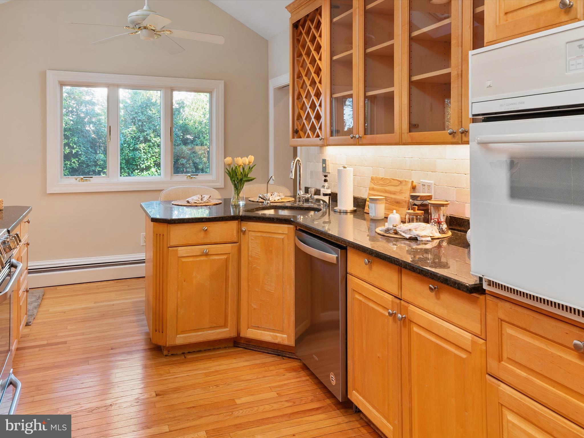 111 Virginia Avenue Edgewater, MD 21037 - Photo 39 of 80 a kitchen with granite countertop wooden cabinets and a sink
