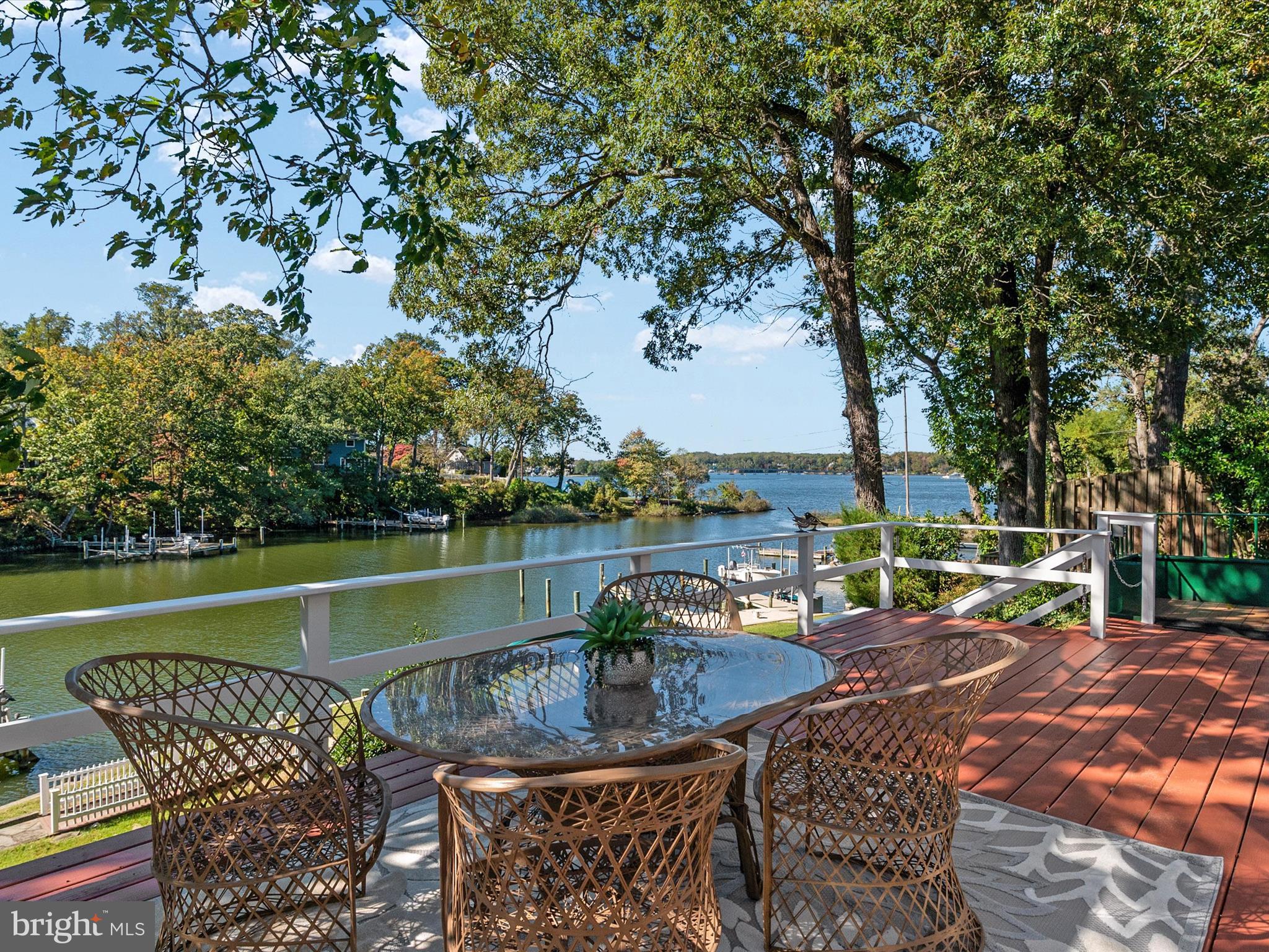 111 Virginia Avenue Edgewater, MD 21037 - Photo 43 of 80 a view of a lake with a table and chairs