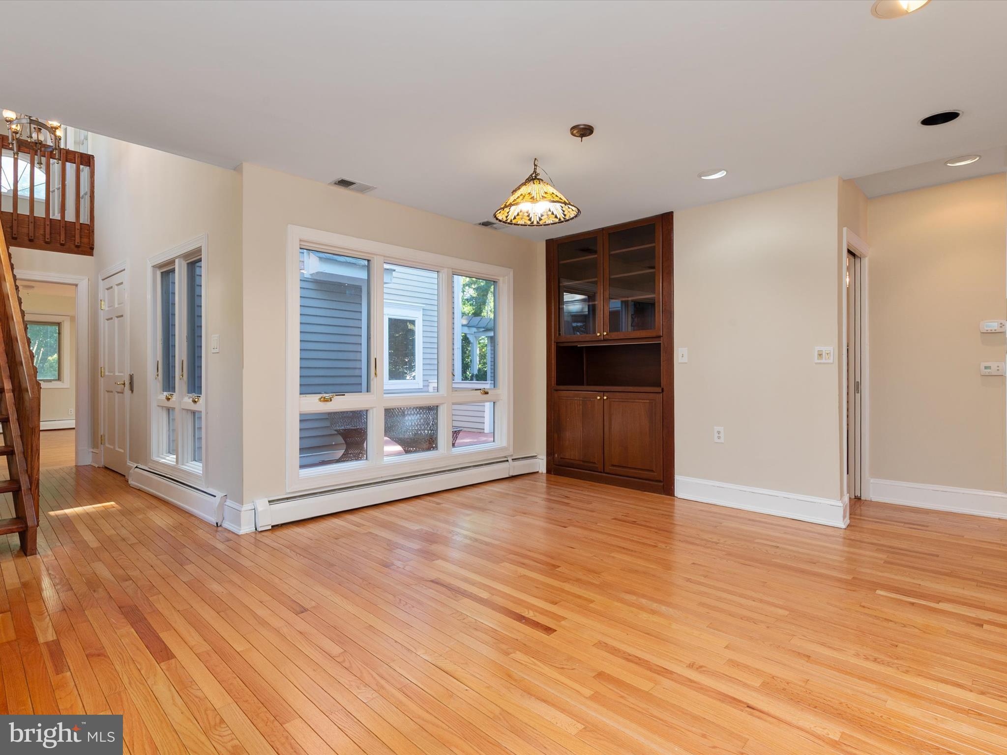 111 Virginia Avenue Edgewater, MD 21037 - Photo 46 of 80 a view of an empty room with wooden floor and a window
