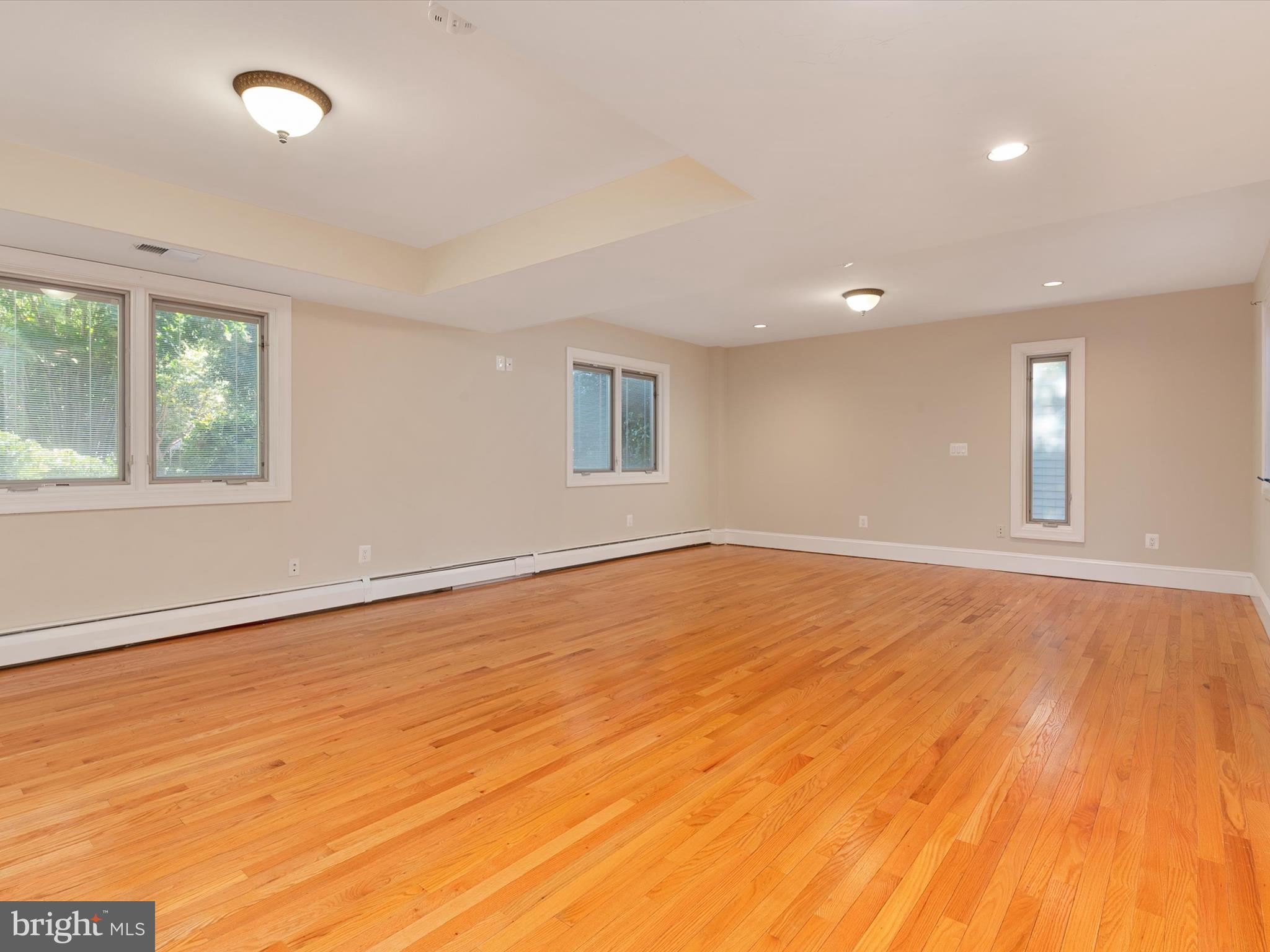 111 Virginia Avenue Edgewater, MD 21037 - Photo 50 of 80 an empty room with wooden floor and windows
