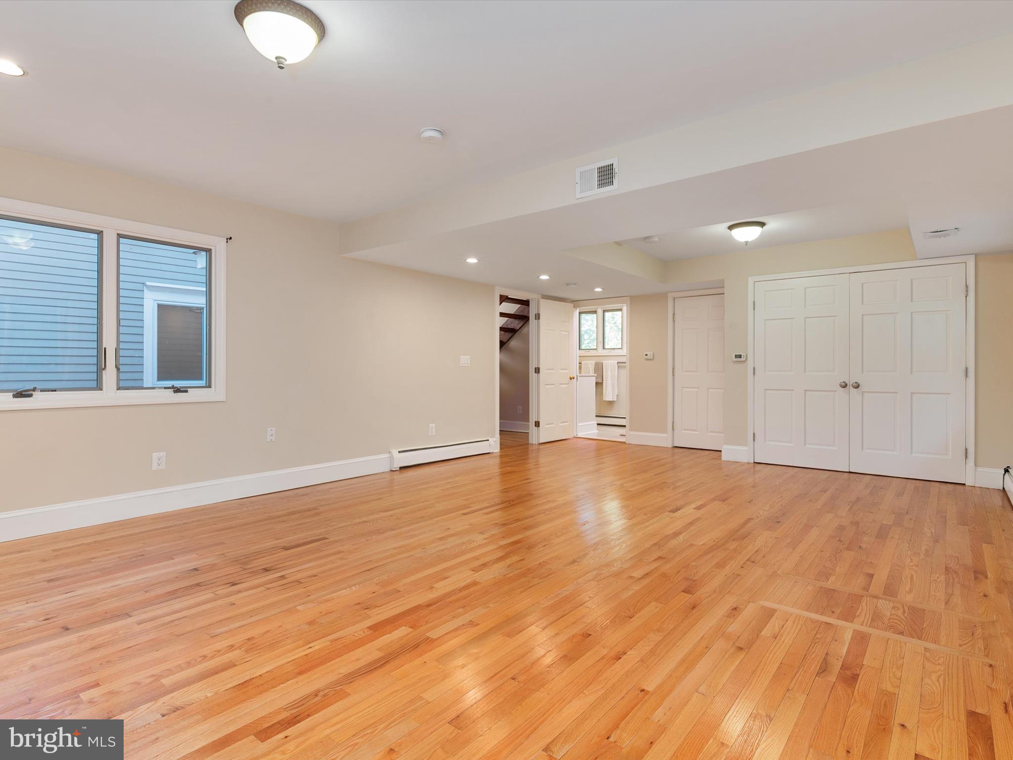 111 Virginia Avenue Edgewater, MD 21037 - Photo 51 of 80 a view of an empty room with wooden floor