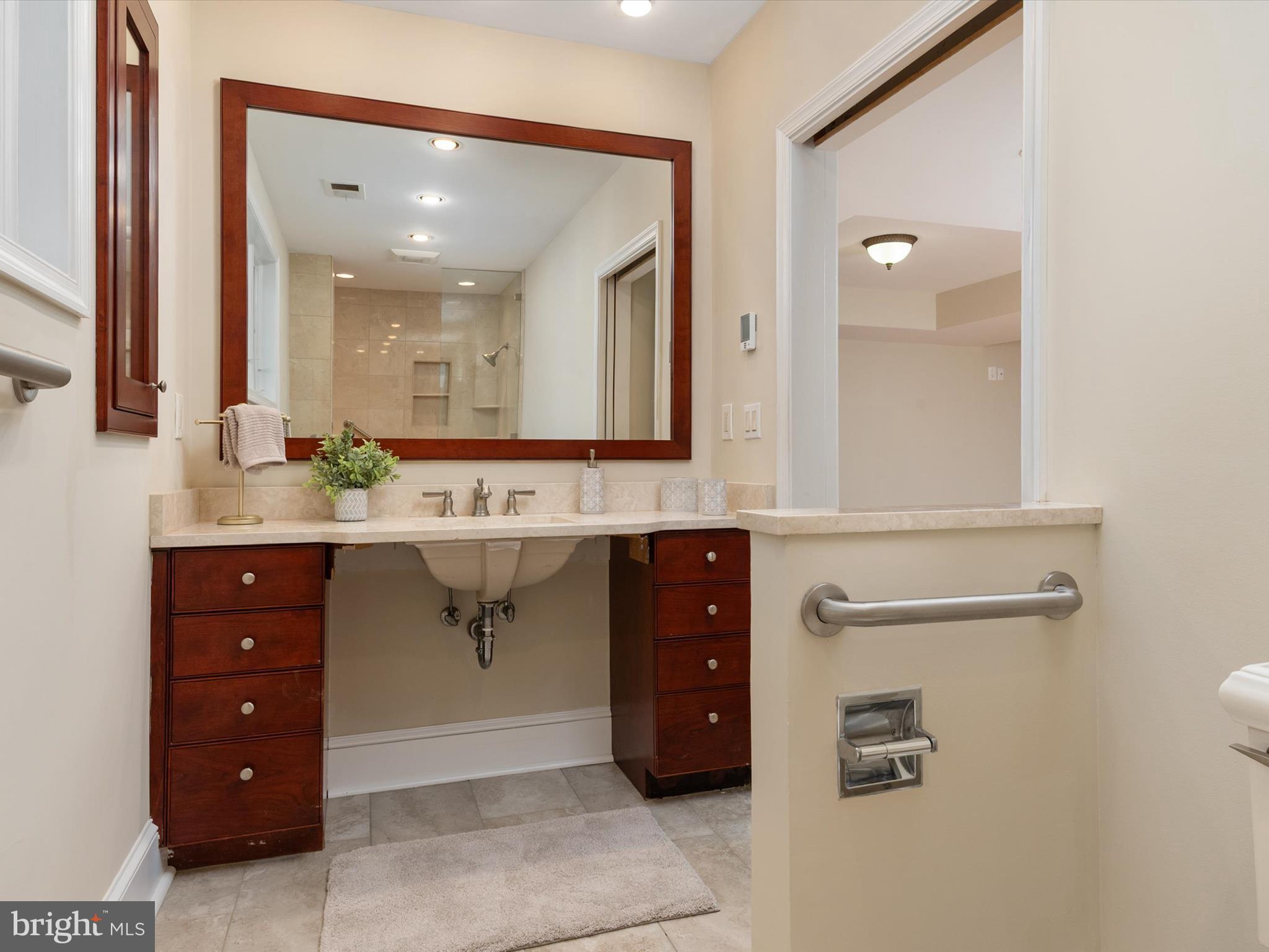 111 Virginia Avenue Edgewater, MD 21037 - Photo 52 of 80 a bathroom with a double vanity sink mirror and double