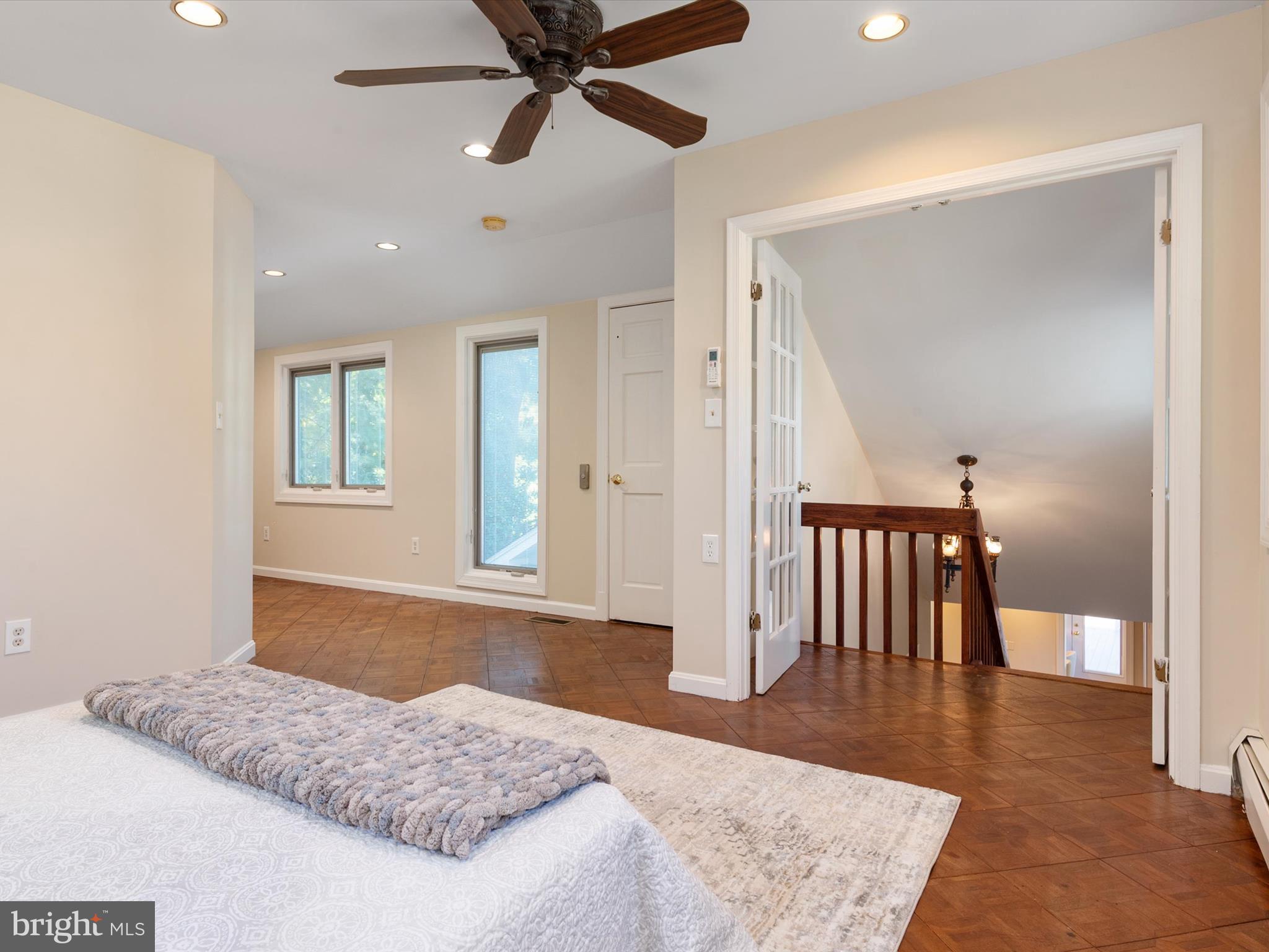 111 Virginia Avenue Edgewater, MD 21037 - Photo 55 of 80 a bedroom with a bed and a chandelier