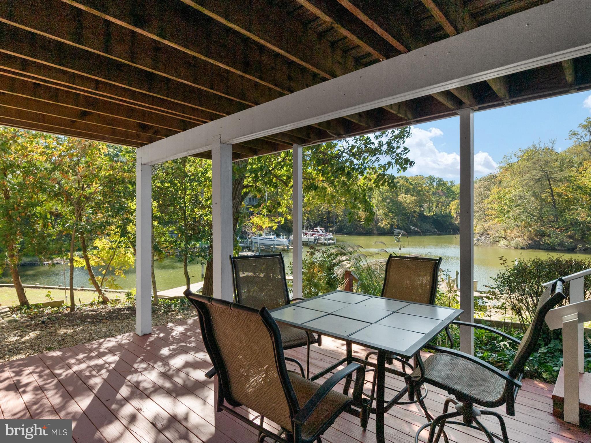 111 Virginia Avenue Edgewater, MD 21037 - Photo 63 of 80 a view of porch with a table and chairs