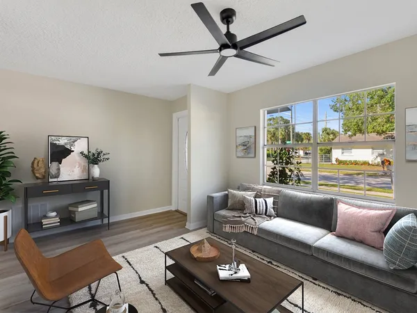 a living room with furniture and a window
