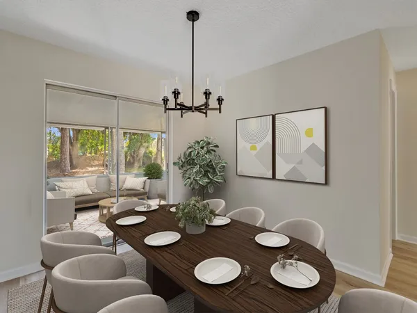 a view of a dining room that has couches and table in it