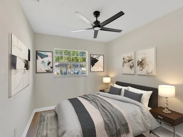a bedroom with a large bed and a window