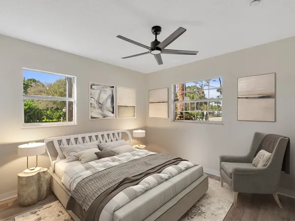 a bedroom with a bed and couch