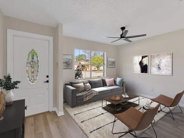 a living room with furniture and a window