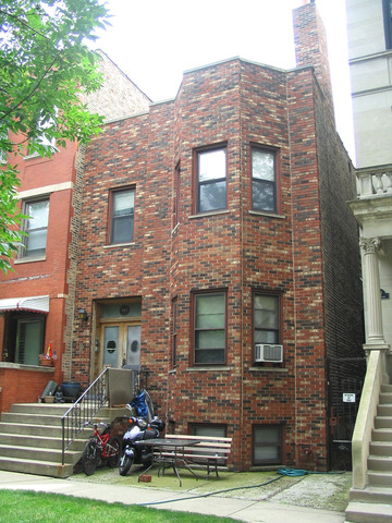 a front view of a house with yard
