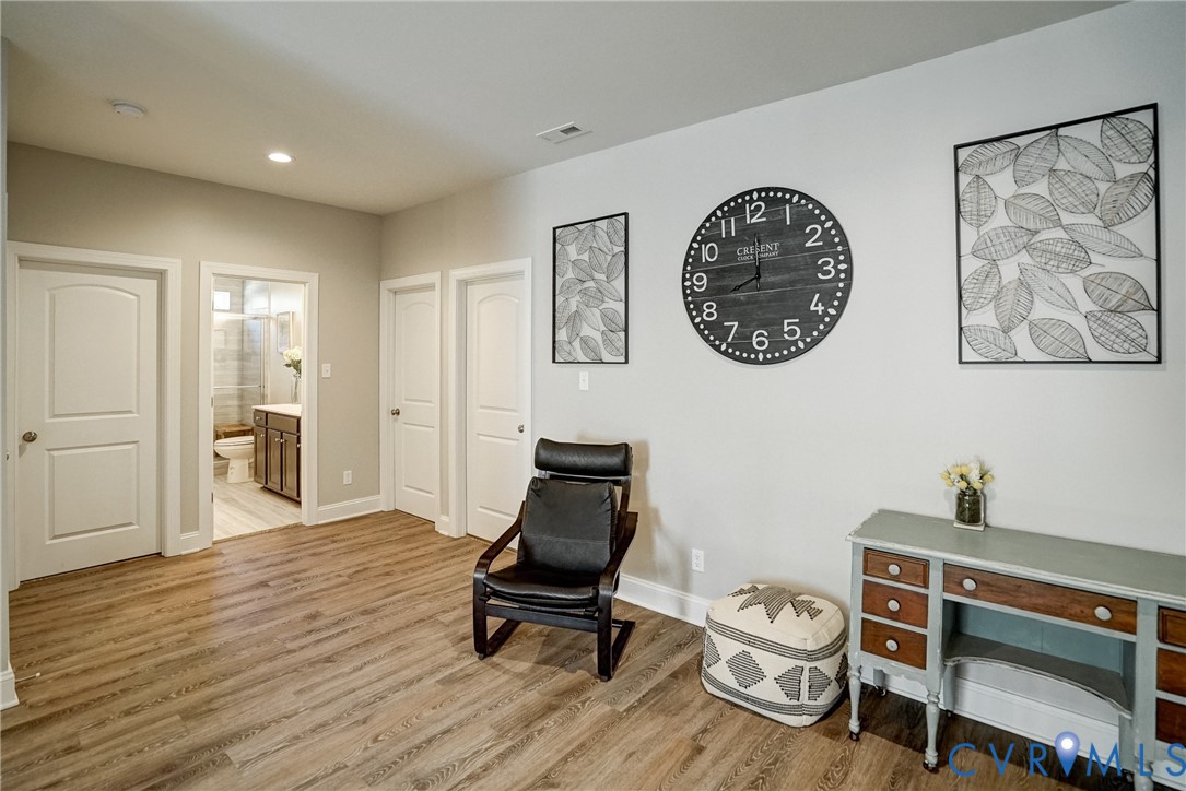 4669 Woburn Road Providence Forge, VA 23140 - Photo 40 of 78 a view of a workspace with furniture and wooden floor